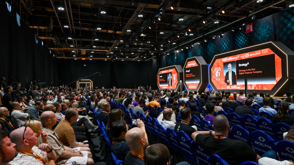 Keynote stage and seated crowd at a Bitcoin Conference edition