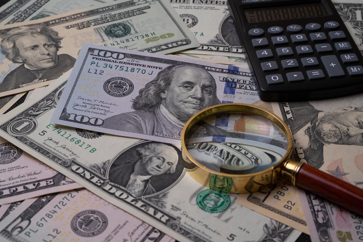 Retirement savings paperwork, representing the choice between a Roth and a Traditional IRA